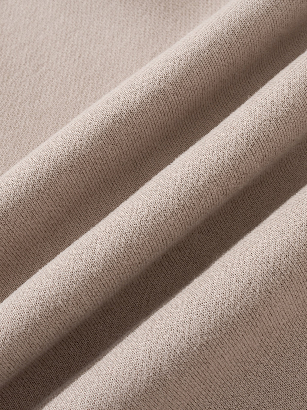Close-up of beige fabric with a soft texture