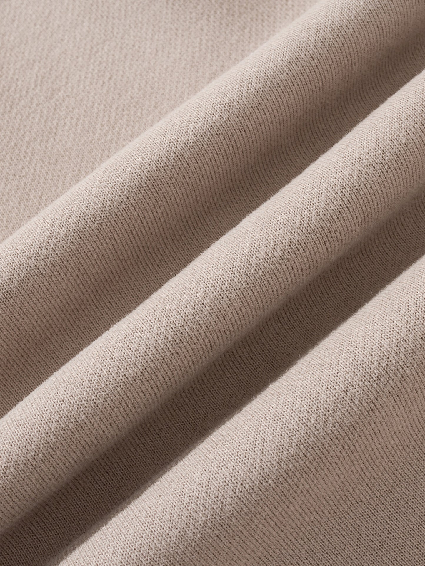 Close-up of beige fabric with a soft texture
