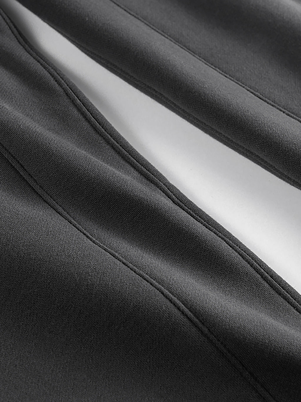 Close-up of black fabric with a white lining