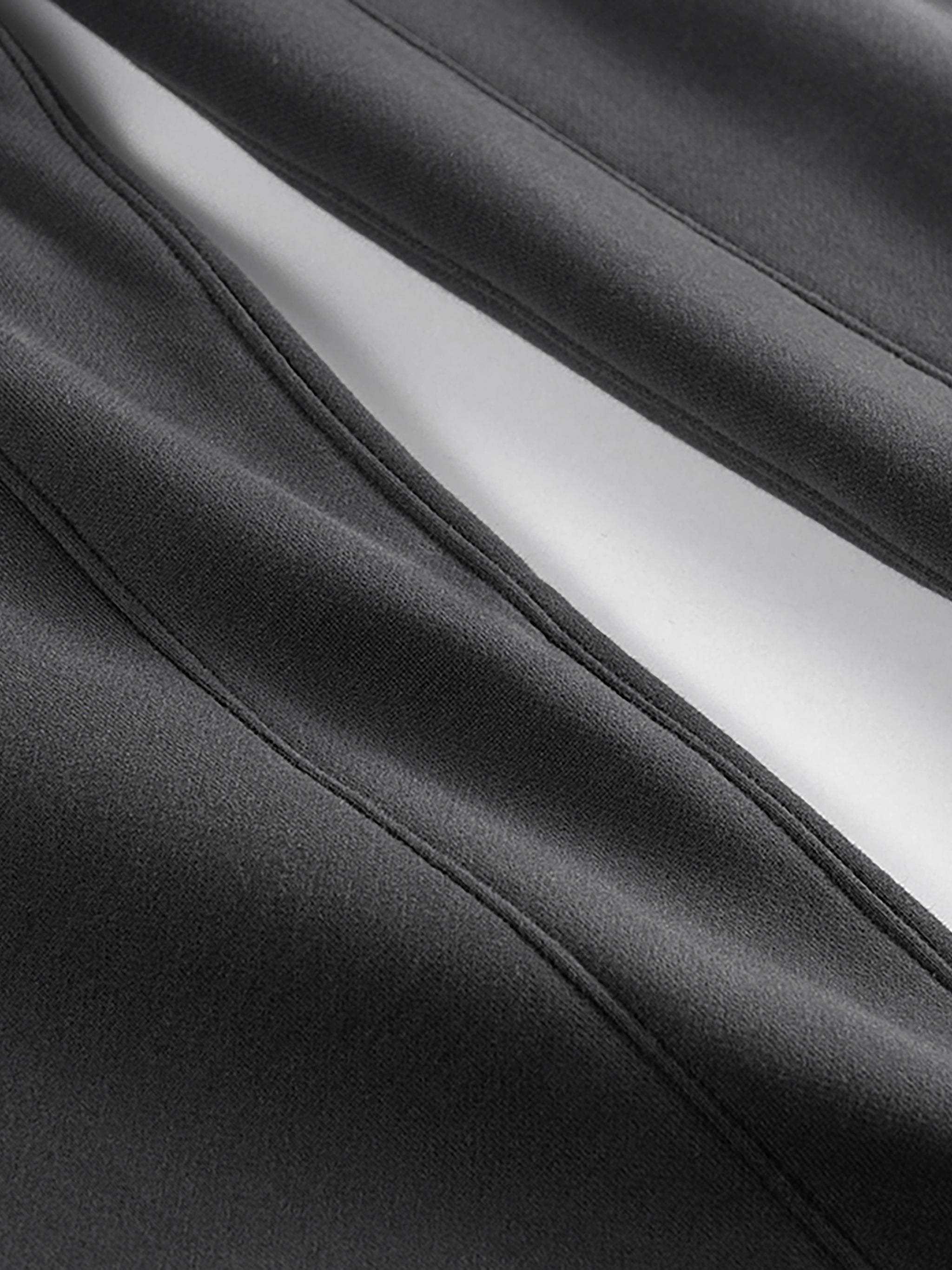 Close-up of black fabric with a white lining