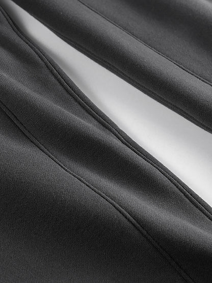 Close-up of black fabric with a white lining
