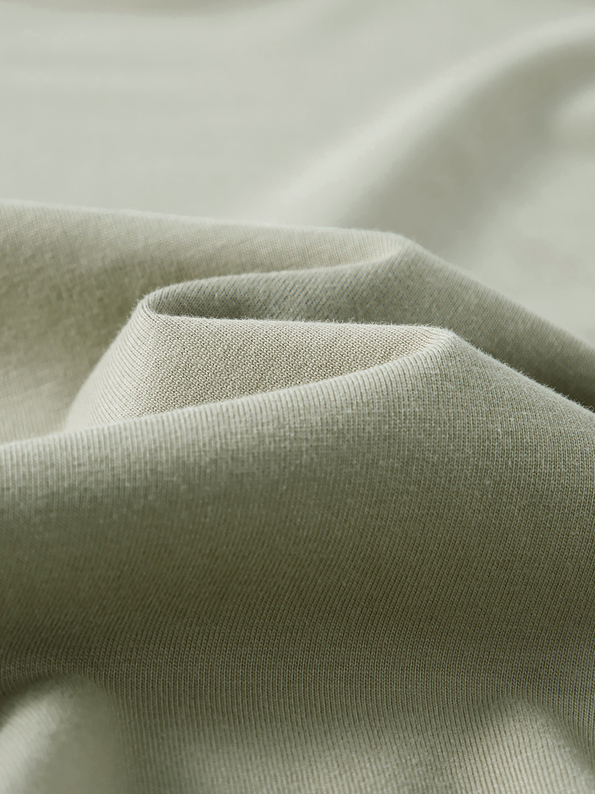 Close-up of green fabric with a soft texture