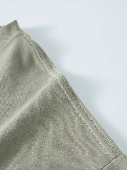 Close-up of a light green fabric with a white background