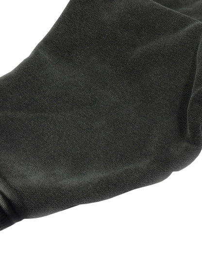 Close-up of a black sock on a white background