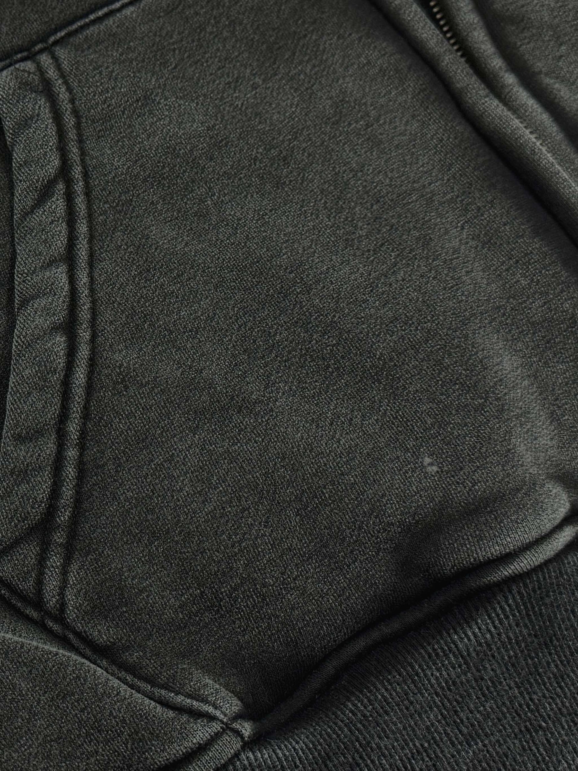 Close-up of dark gray fabric with a textured surface