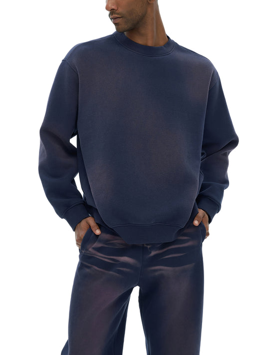 Model wearing VÉRON Rue de l’Université crewneck in urban setting 1