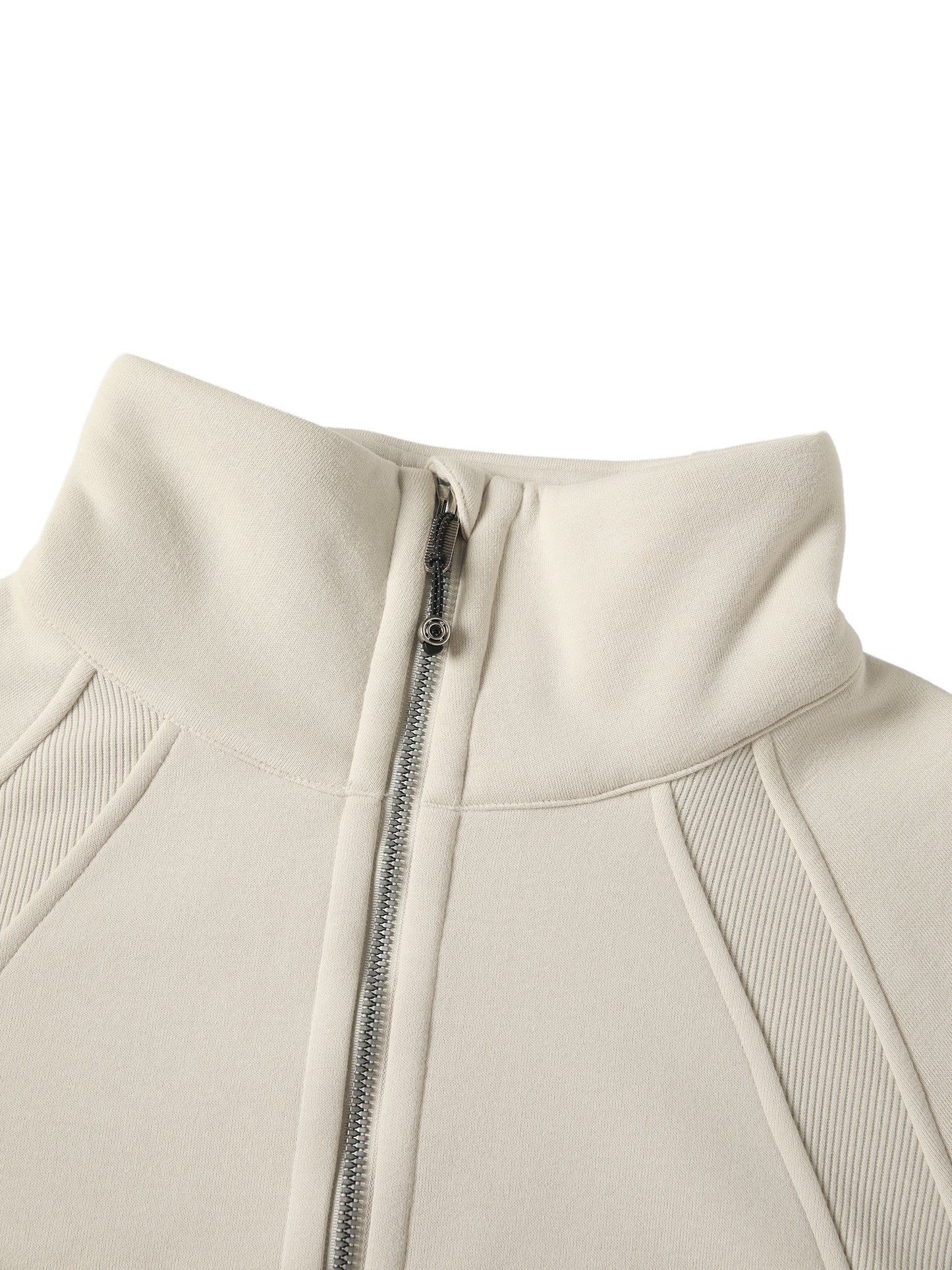 Close-up of a beige jacket with a zipper on a white background