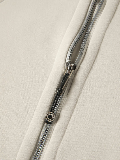 Close-up of a zipper on a beige fabric background