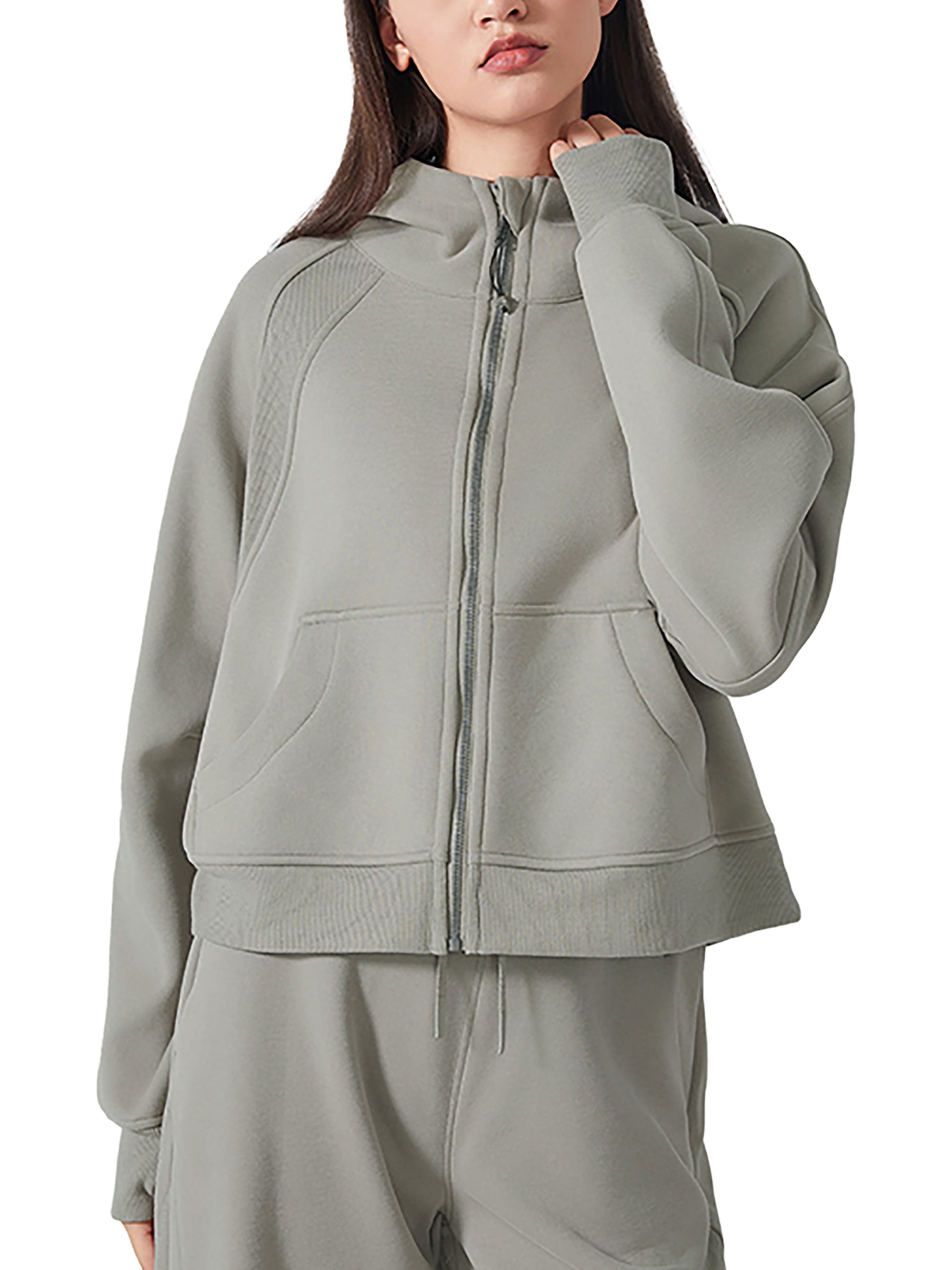 Model wearing VÉRON LA Plume Fitted Half-Zip Women’s Hoodie in green.


