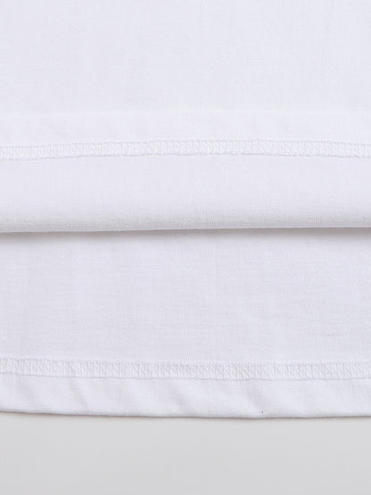 Close-up of white fabric with a subtle pattern on a light gray background