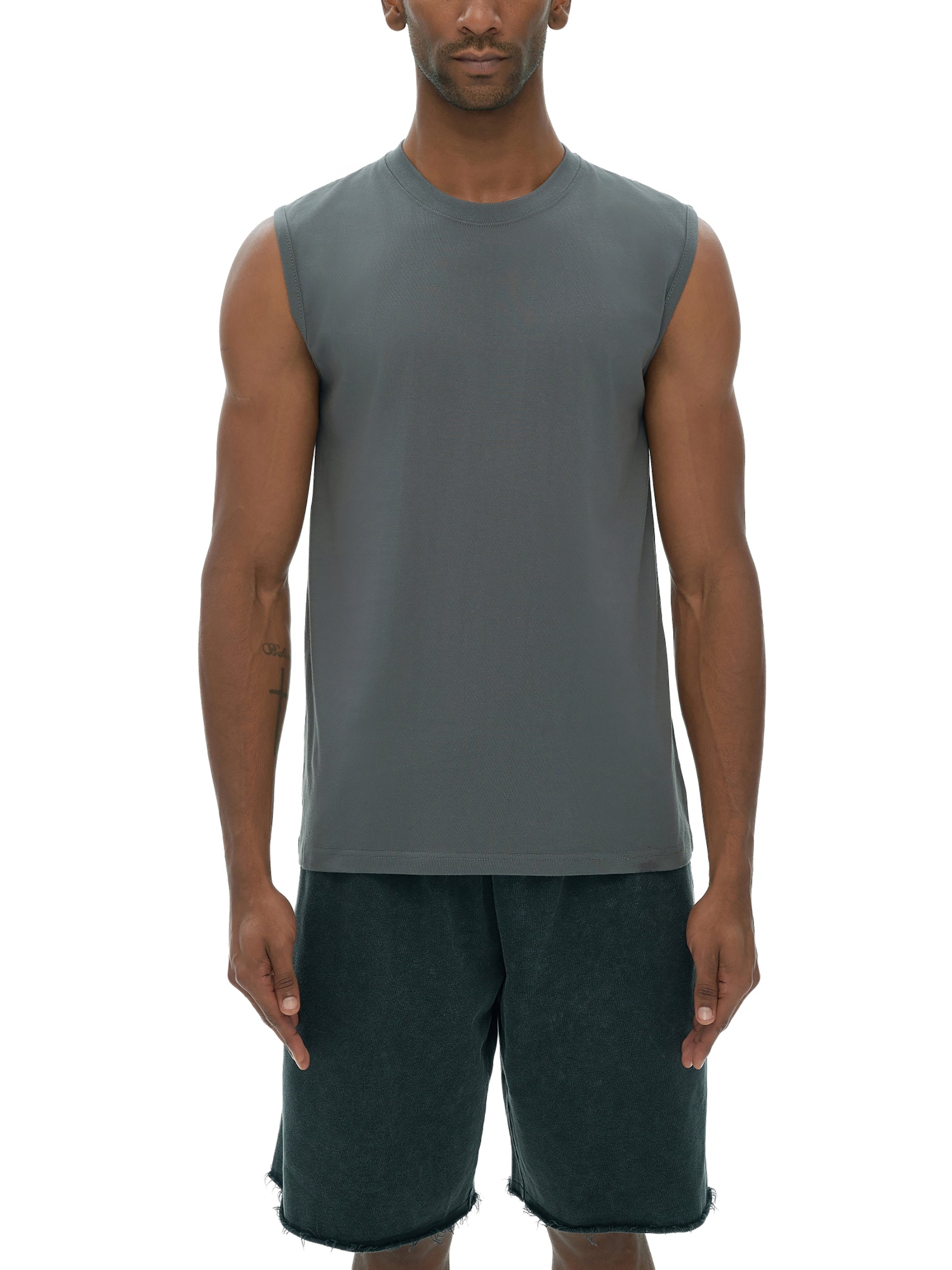 Model wearing VÉRON cotton tank top styled with streetwear shorts 1