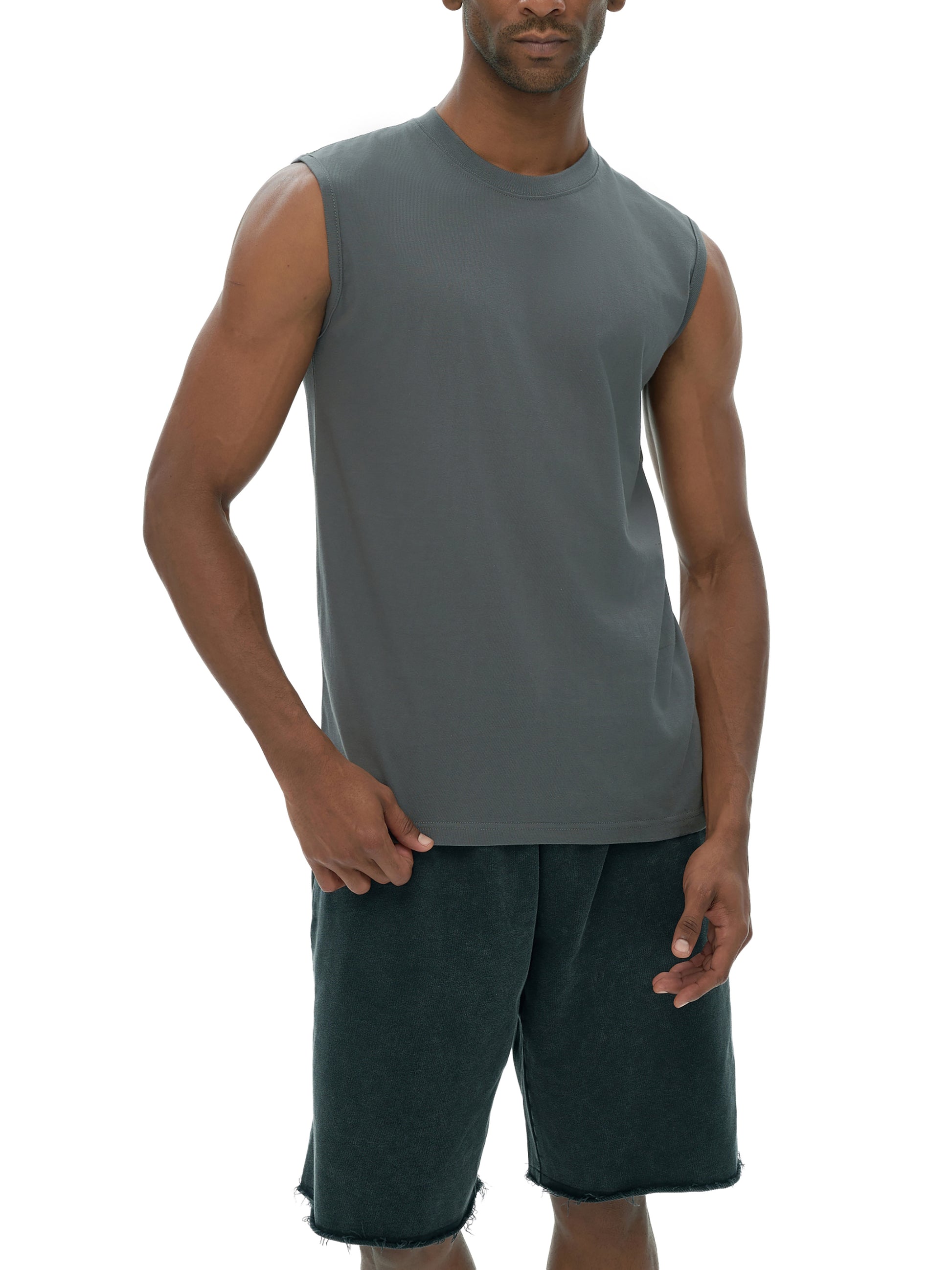 Model wearing VÉRON cotton tank top styled with streetwear shorts 2