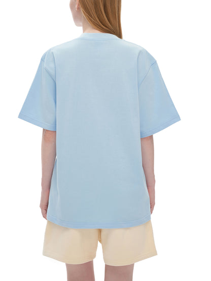 Person wearing a light blue t-shirt and beige shorts on a white background