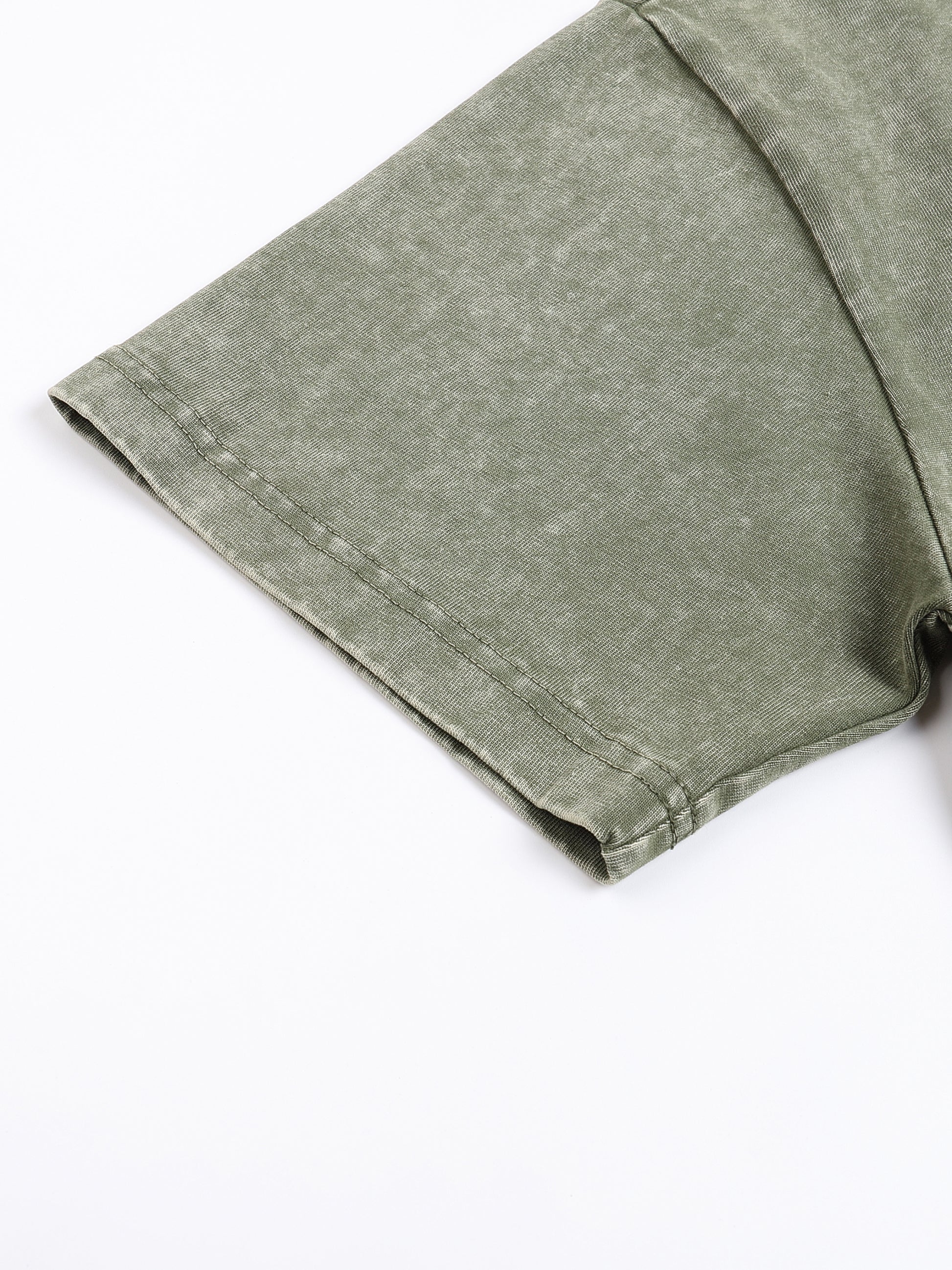Green fabric folded on a white background
