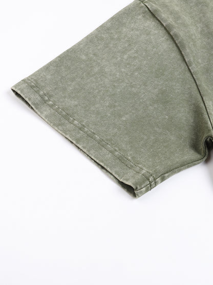 Green fabric folded on a white background