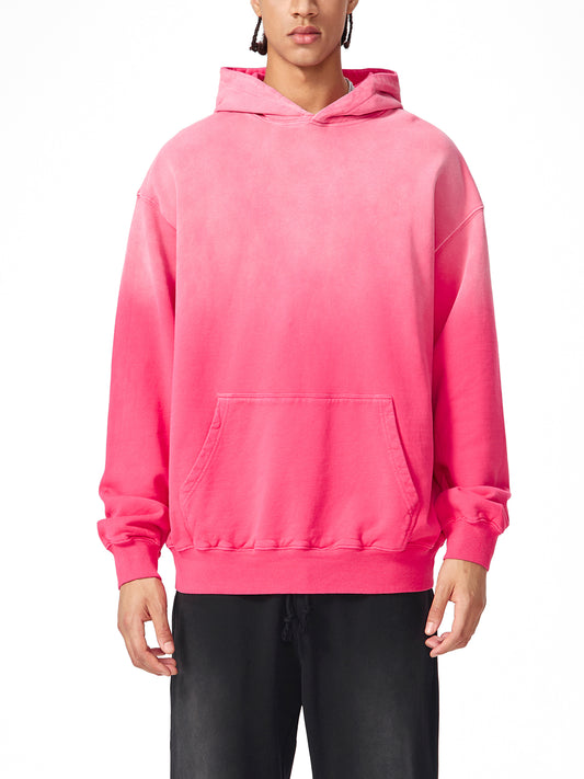 Model wearing VERON bright pink hoodie on a white background