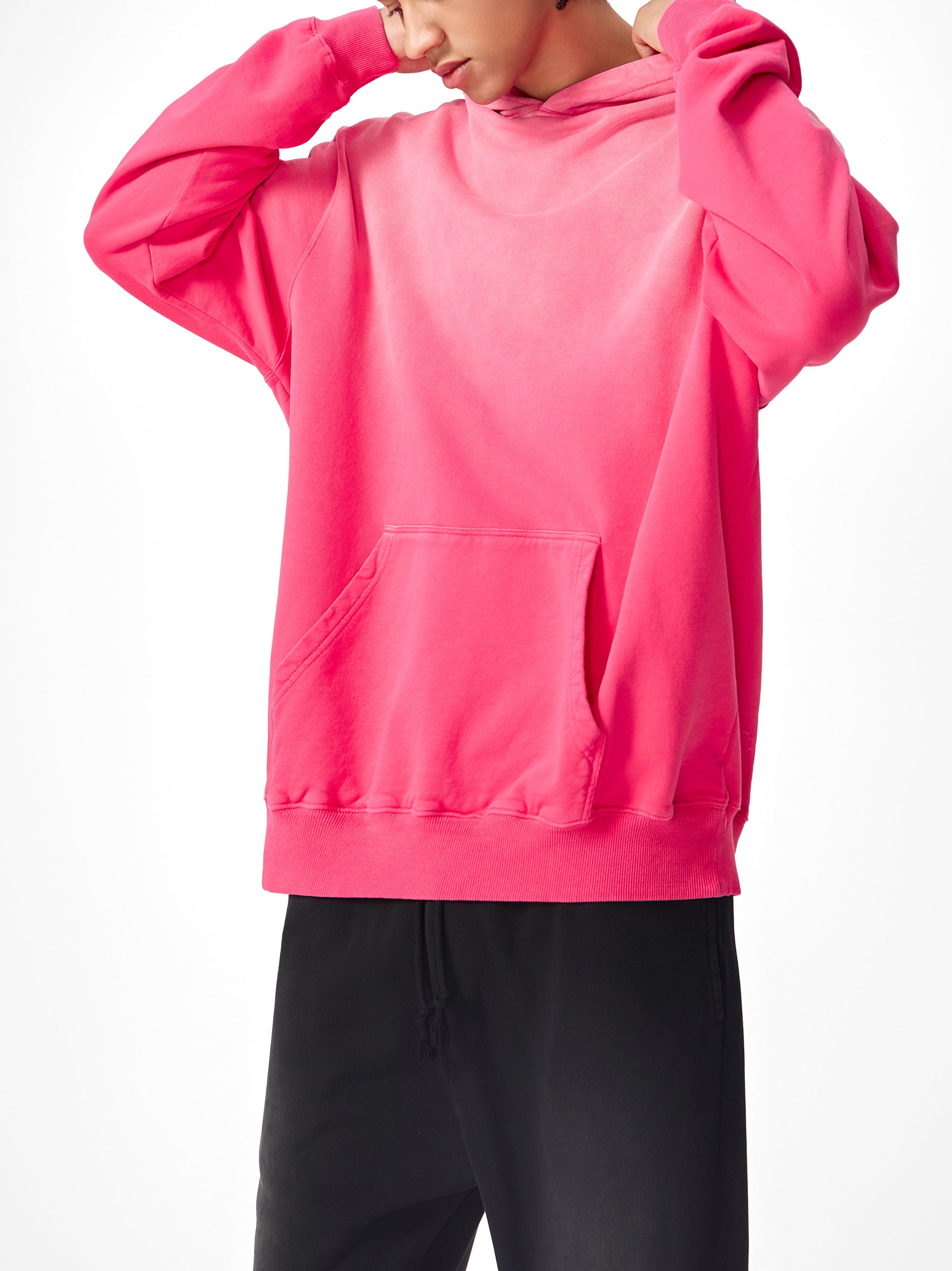 Model wearing VERON bright pink hoodie