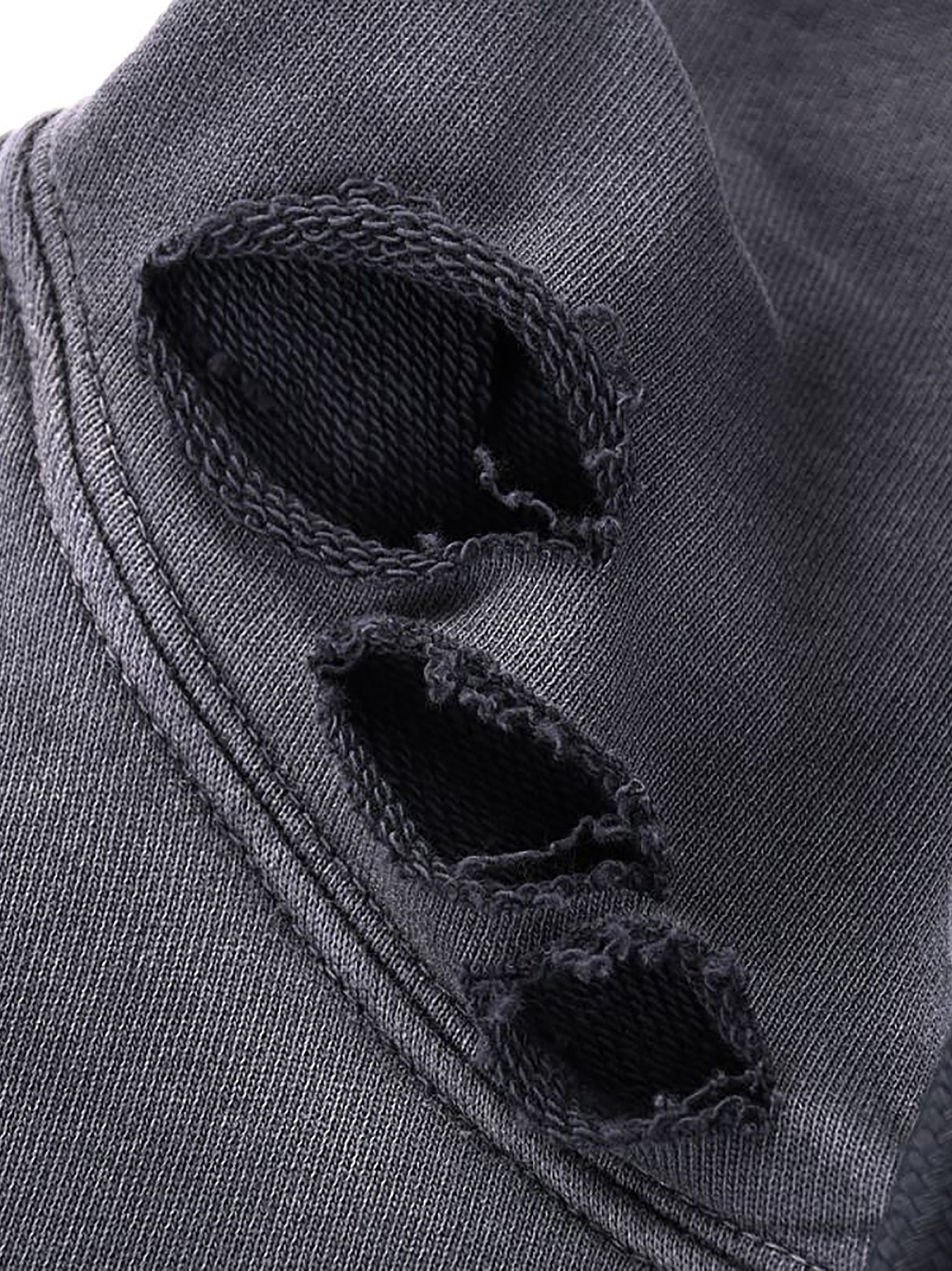 Close-up of a dark gray fabric with frayed edges
