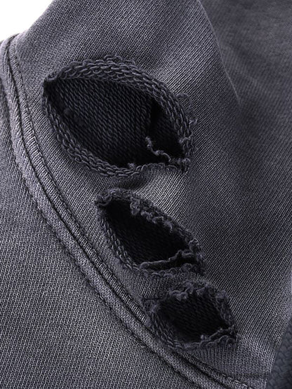 Close-up of a dark gray fabric with frayed edges