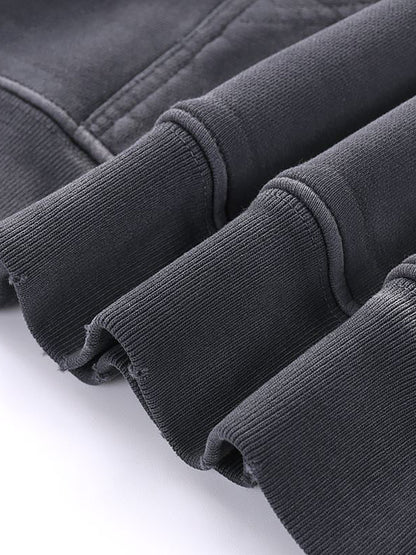 Close-up of dark gray corduroy fabric on a white background