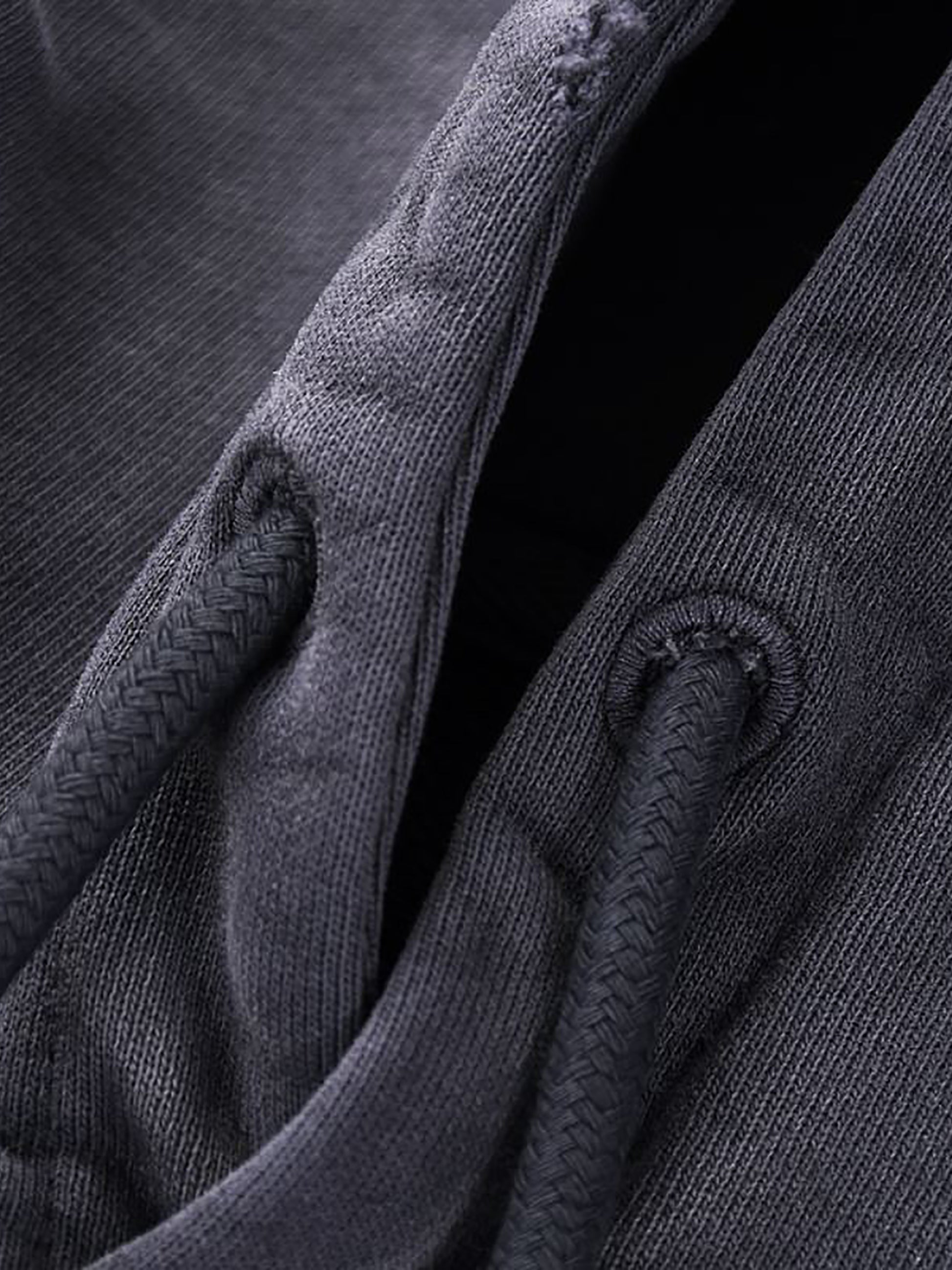 Close-up of dark gray fabric with textured pattern
