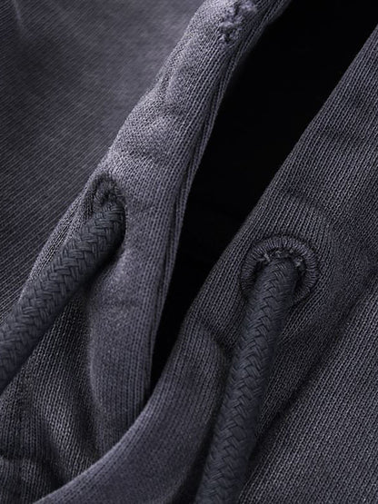 Close-up of dark gray fabric with textured pattern