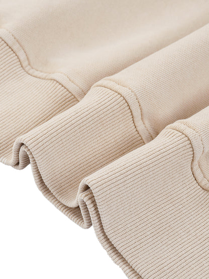 Close-up of beige knit fabric with a white background