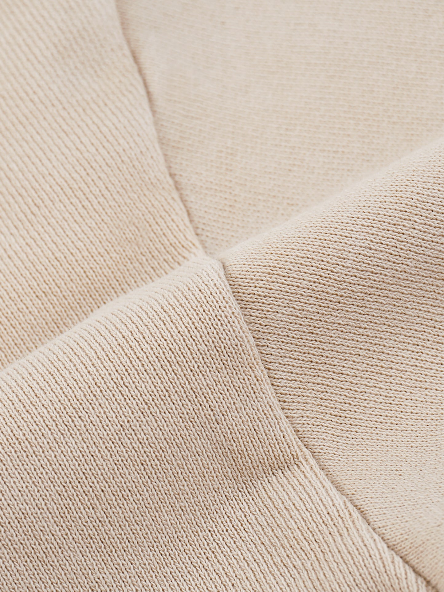 Close-up of beige fabric texture