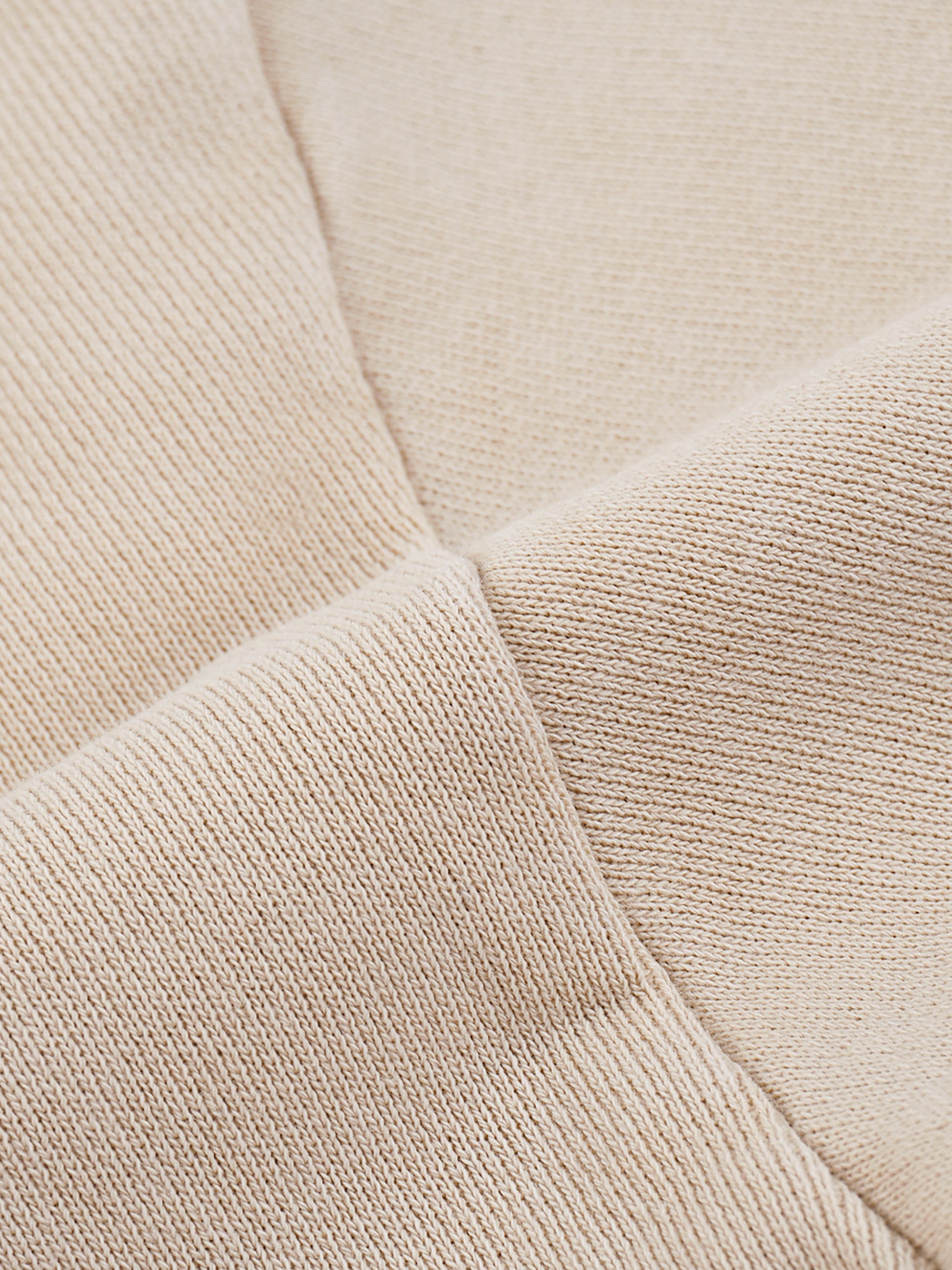 Close-up of beige fabric texture