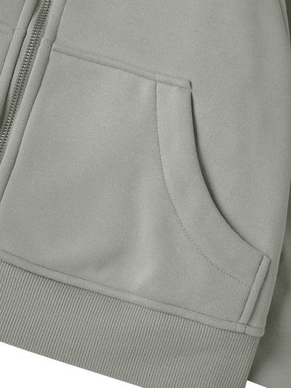 Close-up of a gray jacket with a pocket and zipper