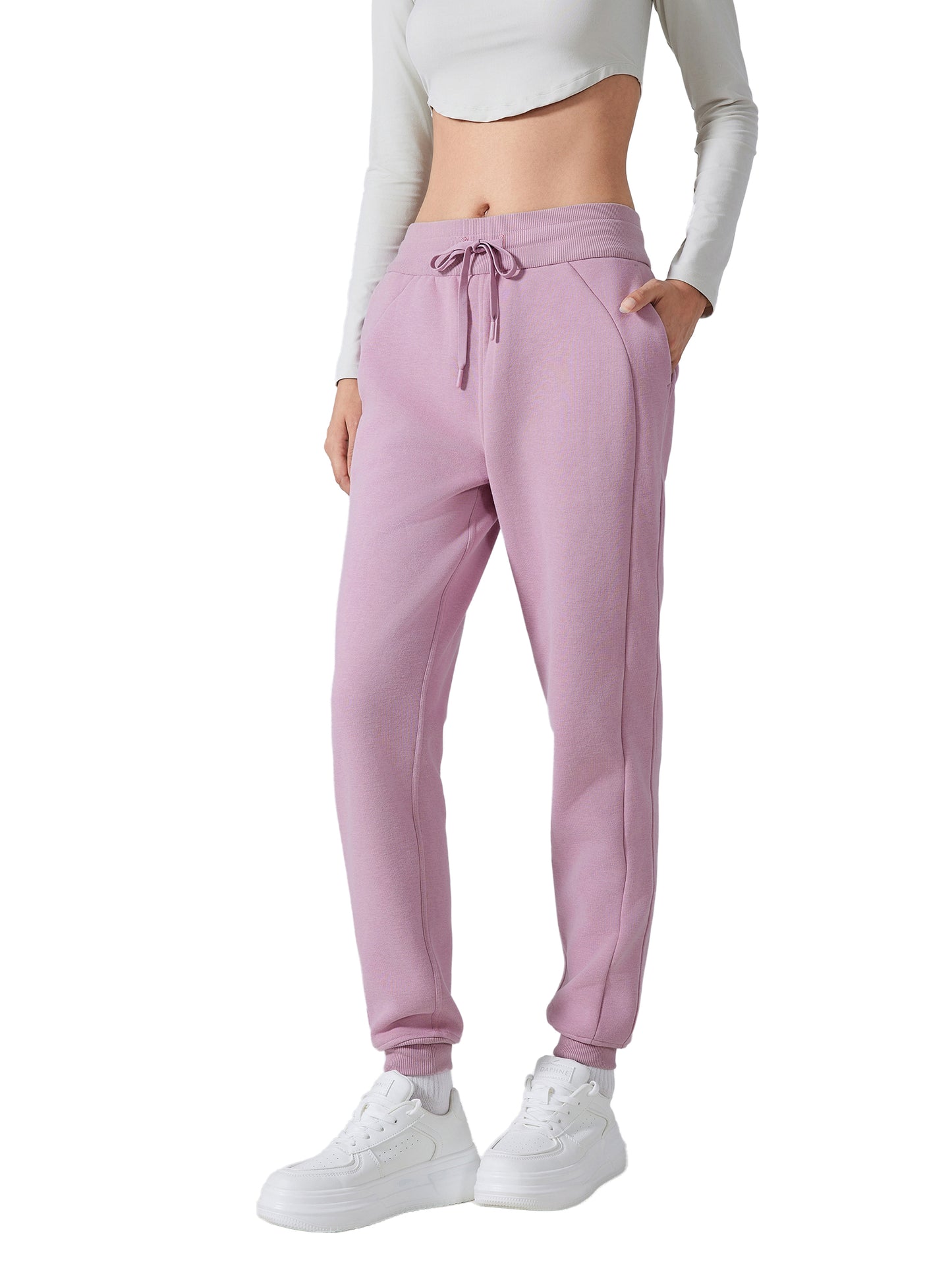 Model wearing VÉRON Noémie luxury streetwear pants with sneakers 4
