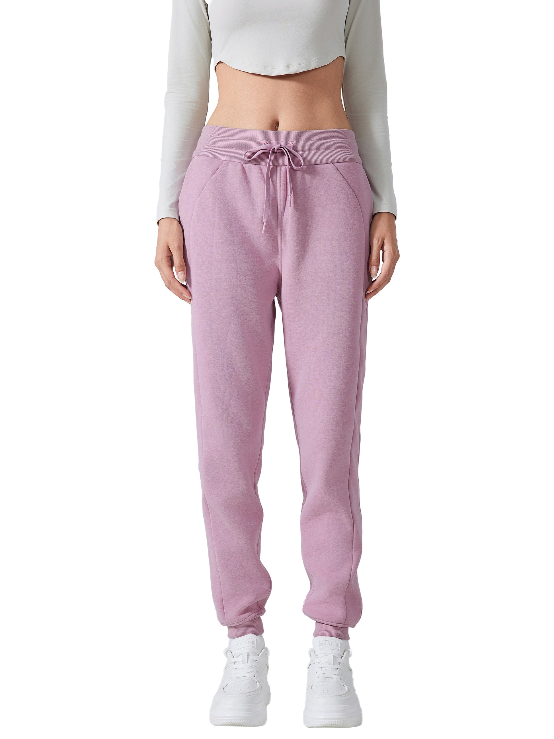 Model wearing VÉRON Noémie luxury streetwear pants with sneakers 2