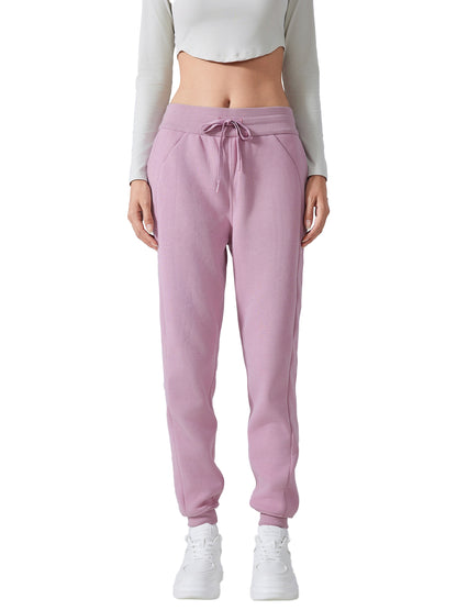 Model wearing VÉRON Noémie luxury streetwear pants with sneakers 2