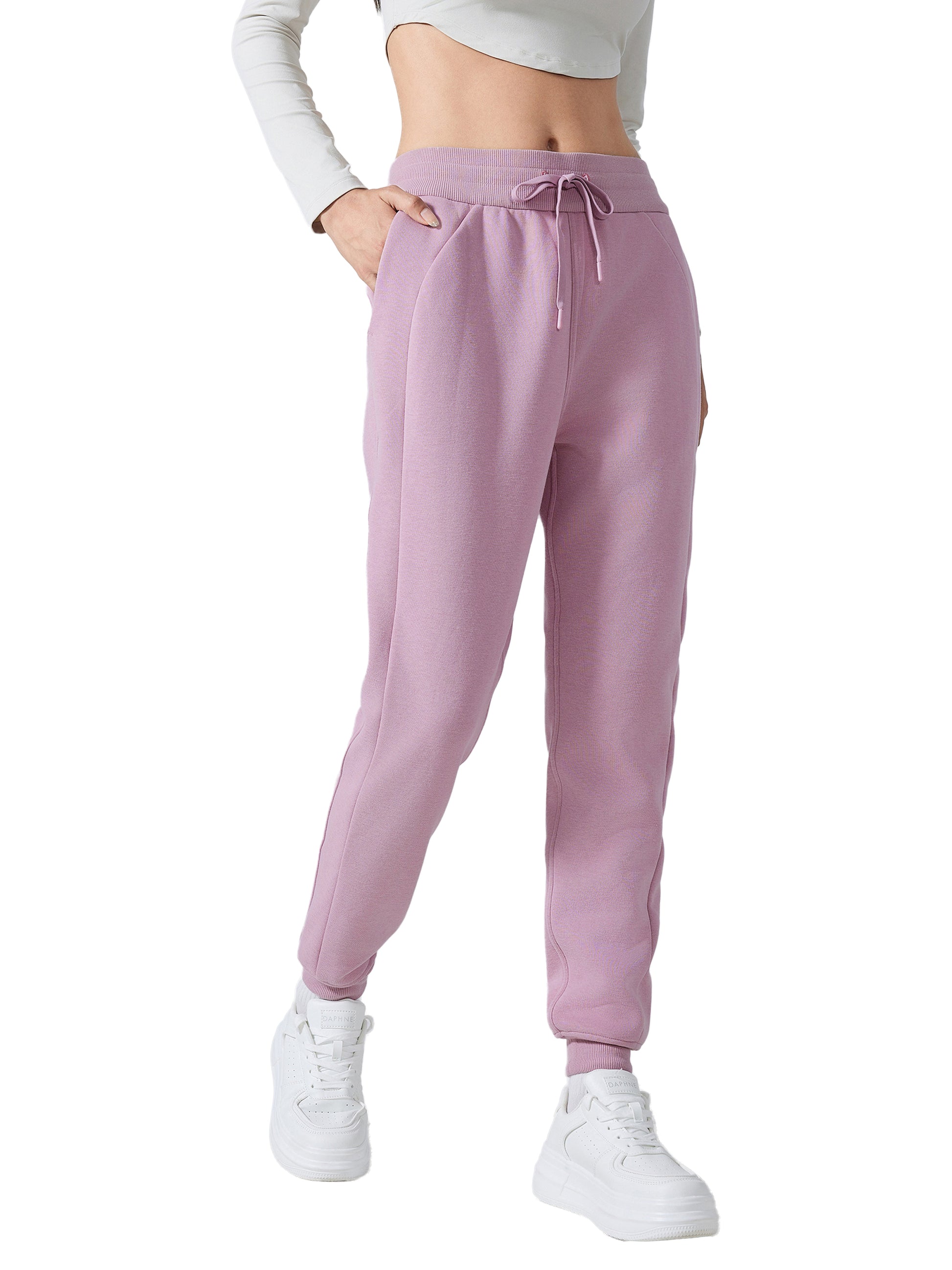 Model wearing VÉRON Noémie luxury streetwear pants with sneakers 1