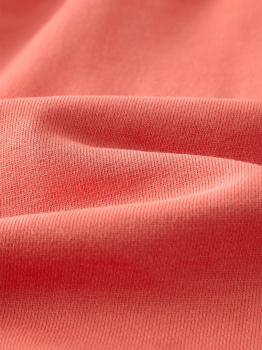 VERON Close-up of pink fabric with visible texture