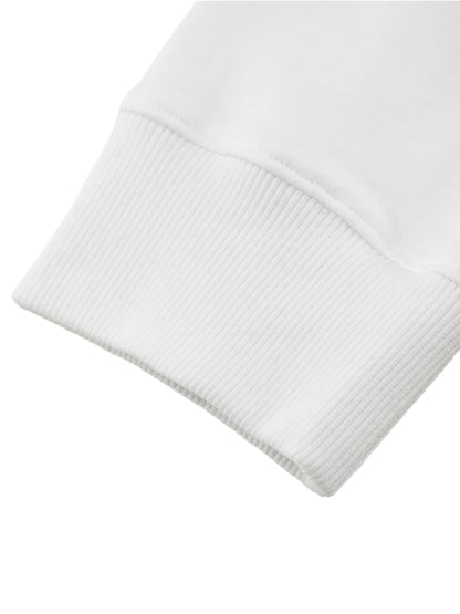 Close-up of a white ribbed knit sweater sleeve on a white background