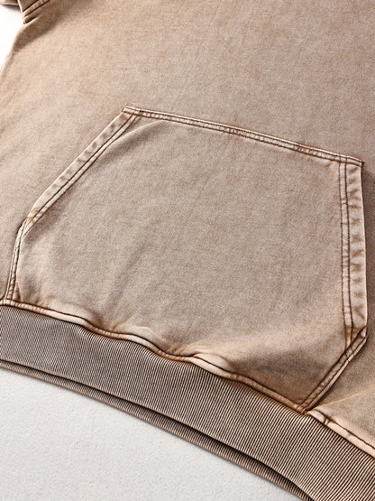 Close-up of a brown denim pocket on a garment.