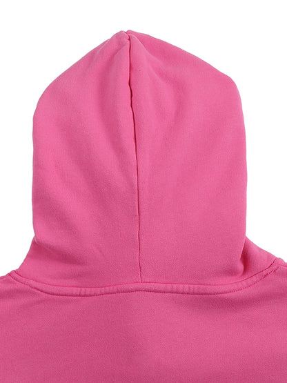 Close-up of a pink hoodie with a hood on a white background