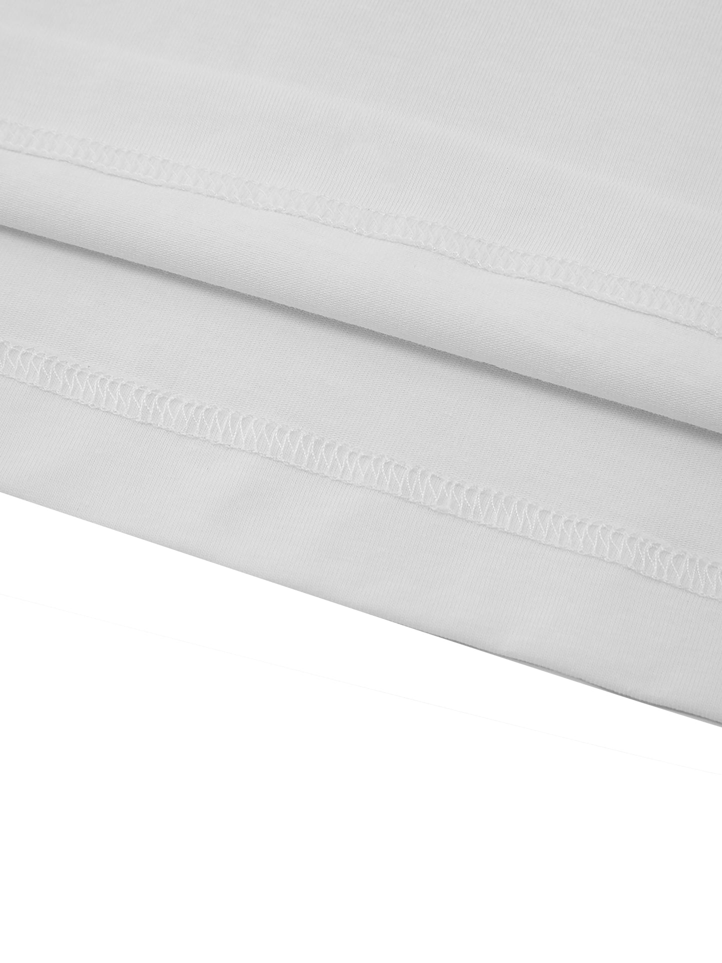 Close-up of a white fabric with a subtle pattern on a white background