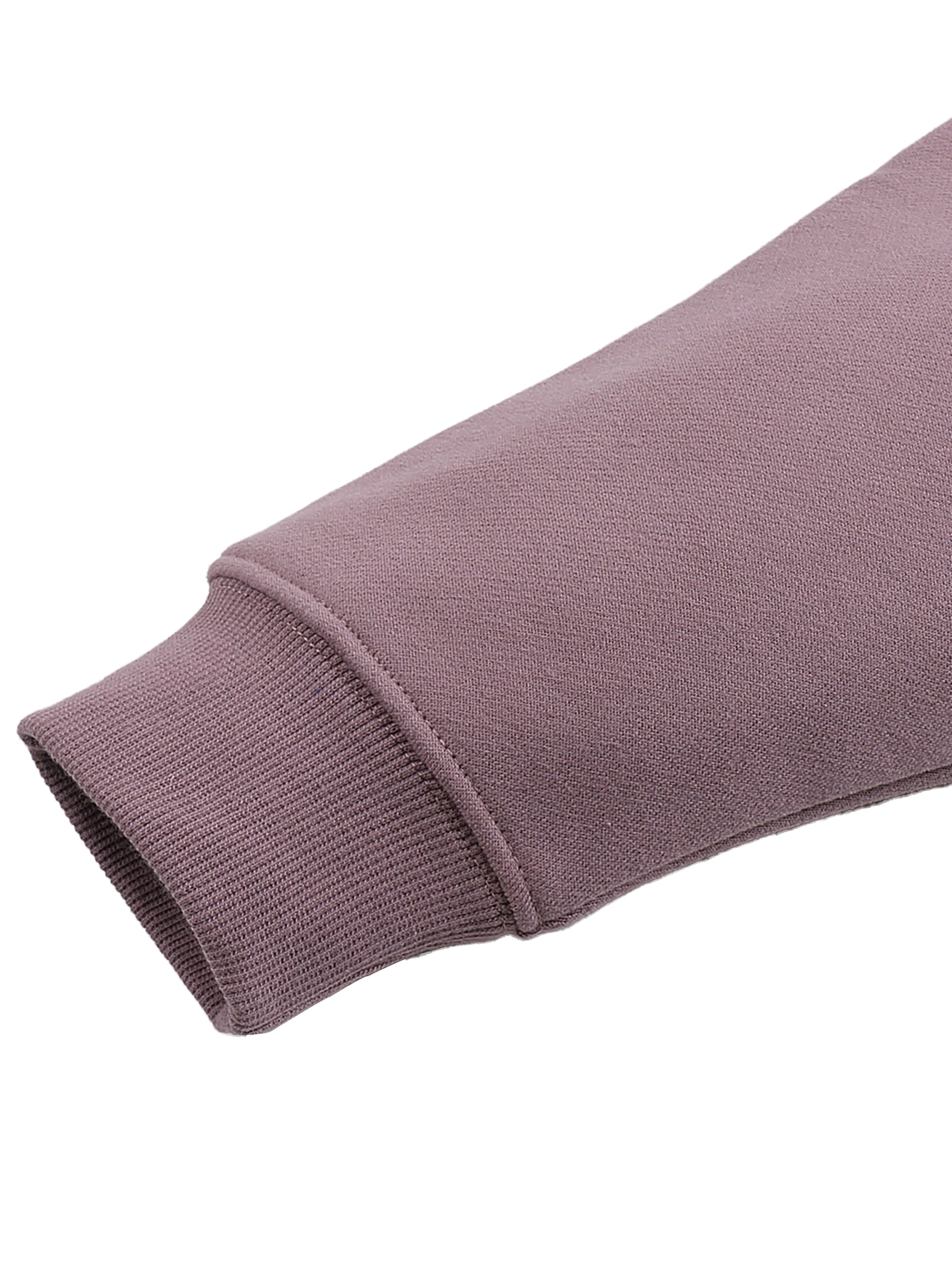 Close-up of a purple hoodie sleeve on a white background