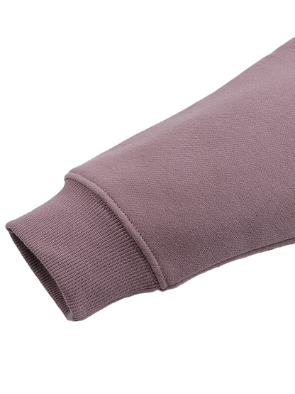 Close-up of a purple hoodie sleeve on a white background