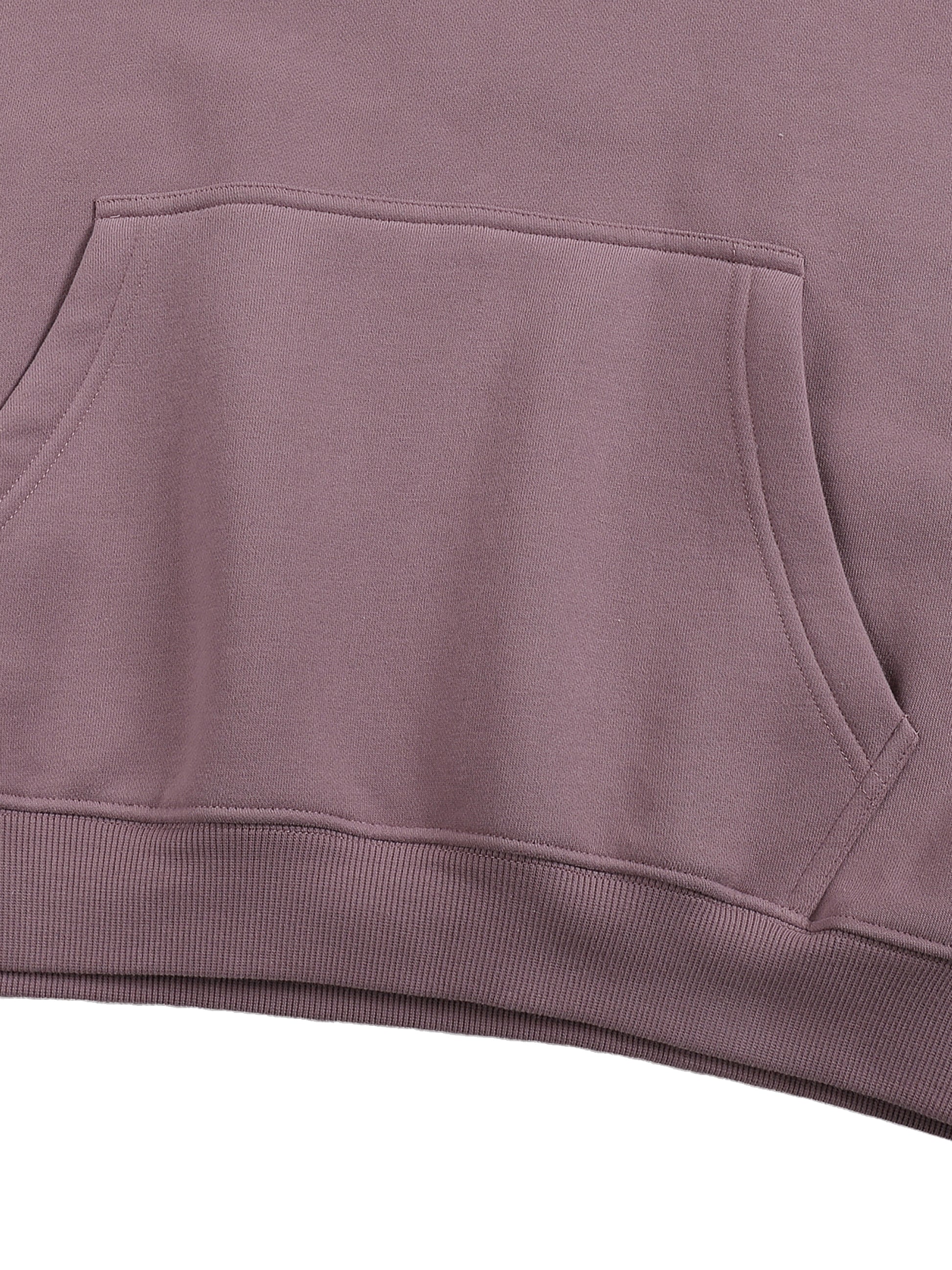 Close-up of a purple hoodie with a pocket on a white background
