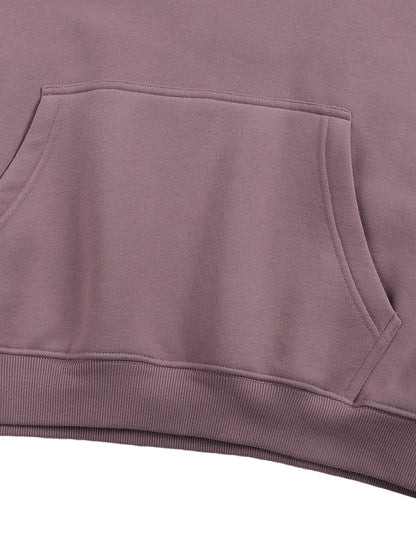 Close-up of a purple hoodie with a pocket on a white background