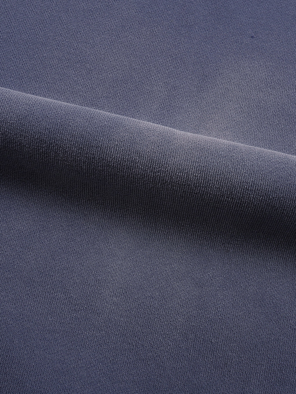 Close-up of dark blue fabric with a subtle texture