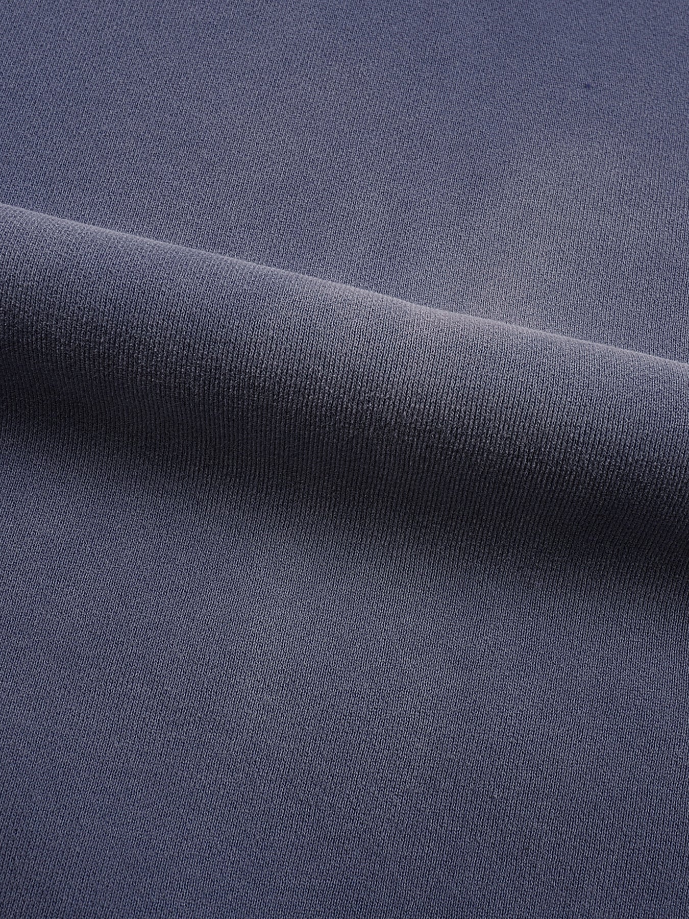 Close-up of dark blue fabric with a subtle texture
