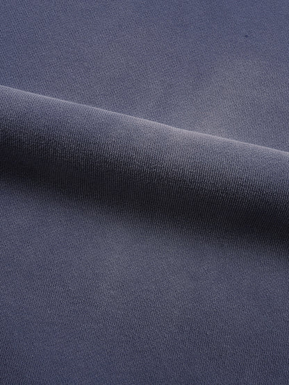 Close-up of dark blue fabric with a subtle texture