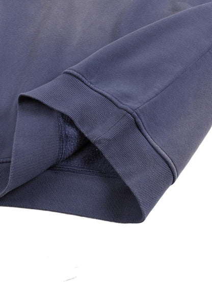 Close-up of a folded navy blue fabric on a white background