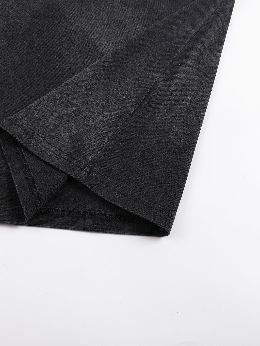 Black fabric folded on a white background