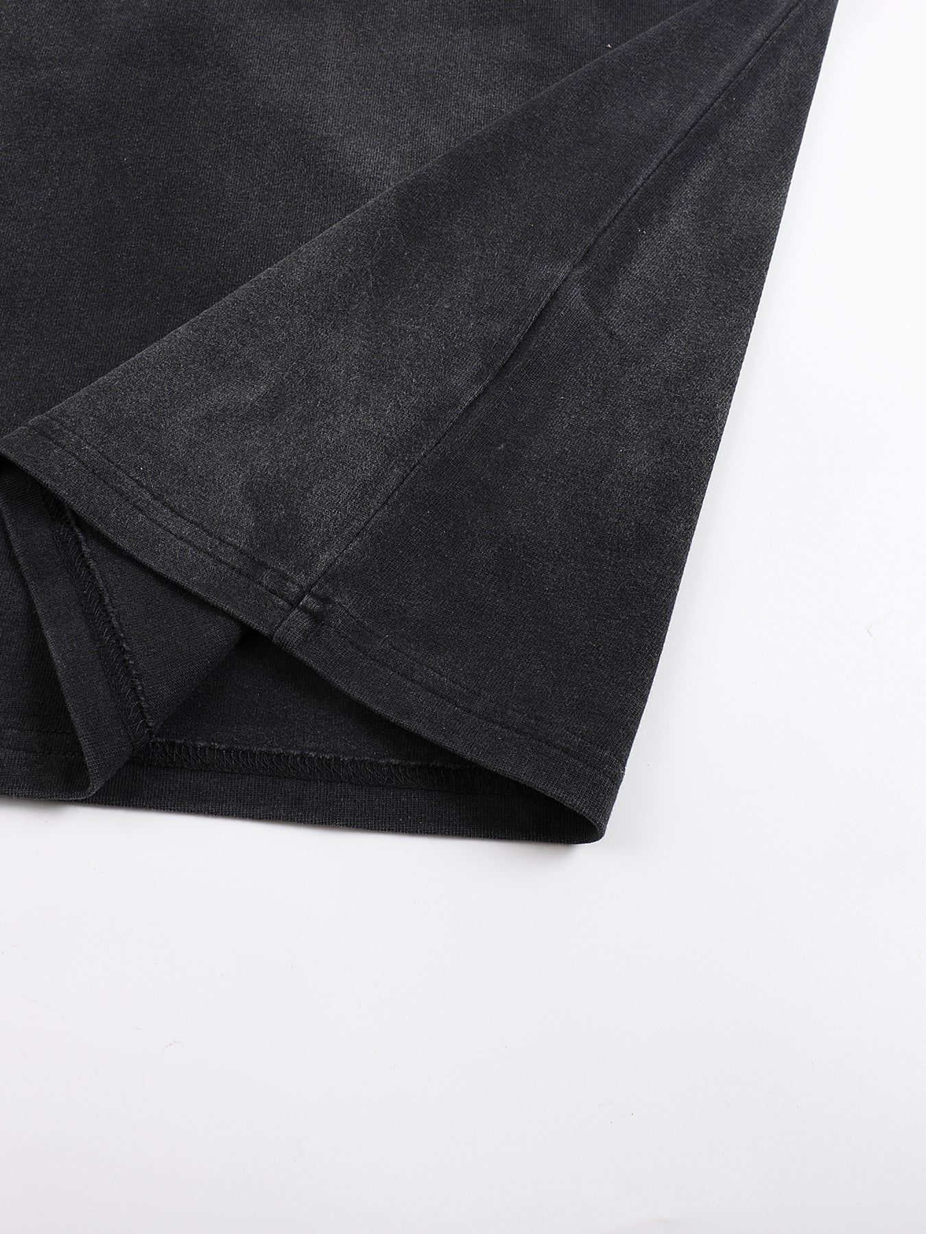 Black fabric folded on a white background