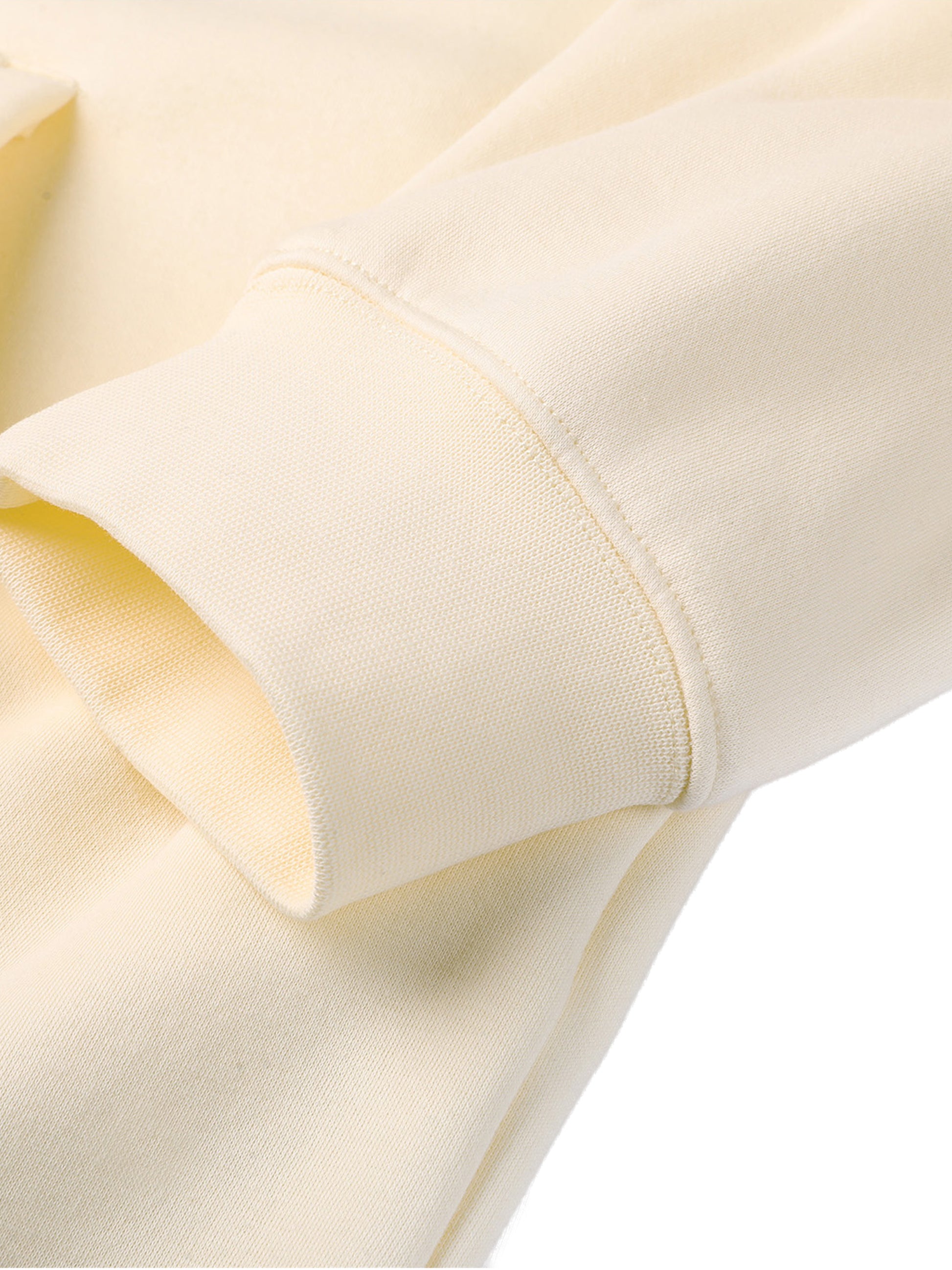 Close-up of a beige fabric with a subtle pattern on a white background